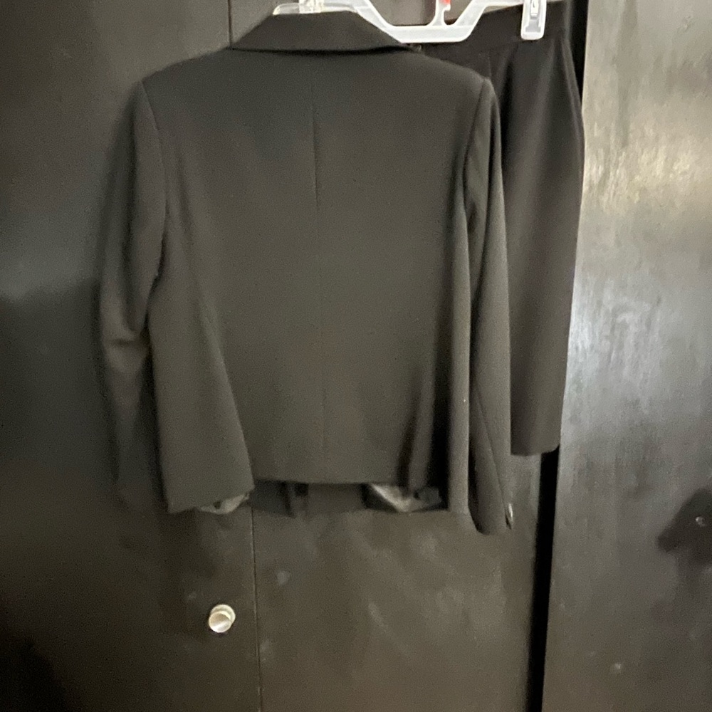 Woman’s petite skirt suit set.